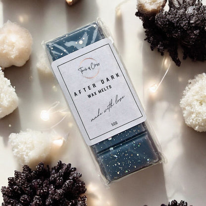 A close up photo of After Dark wax melts by touch of class.  The wax melt is in the shape of a snap bar